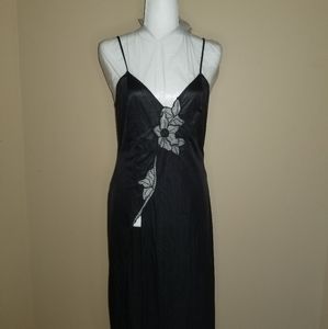 Black slip dress w/ a slit and mesh flower detail